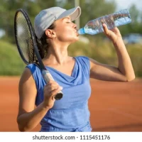 beautiful-young-tennis-player-drinking-260nw-1115451176