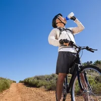 depositphotos_50053999-stock-photo-fit-cyclist-drinking-water-on